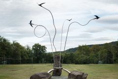 Monument at the entrance of the village of Rondine, Arezzo. Each swallow has its ownflight.